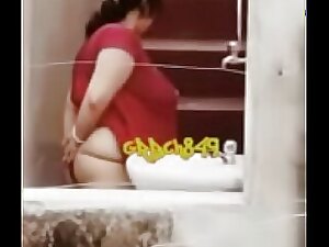 Desi auntie's private moments caught on camera as she relieves herself. See it all in HD quality.